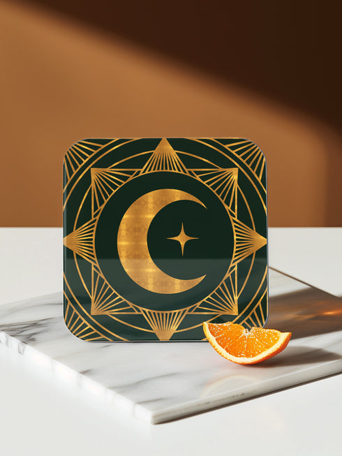 A set of four square coasters with a glossy finish, featuring celestial gold designs on a deep forest green background. Each coaster showcases a unique motif: a stylized sun with a serene face, a crescent moon with a star, a triple moon symbol with botanical elements, and a radiant sunburst. The intricate gold linework creates an art deco-inspired, mystical aesthetic. Made from durable materials, these coasters blend elegance with celestial charm.